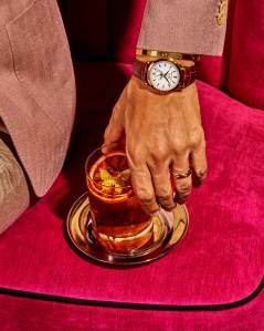 Patek PhilippeÕs Ref. 5396R -011 watch, annual calendar with moon phases in rose gold with silvery opaline dial and gold applied hour markers, featuring a mechanical, self-winding movement.Cartier Love 18-karat yellow gold bracelet. Trinity de Cartier ring, small model, 18-karat white gold, 18-karat yellow gold, 18-karat rose gold. Boglioli wool jacket. Giorgio Armani wool trousers. Morning Cloak drink.
