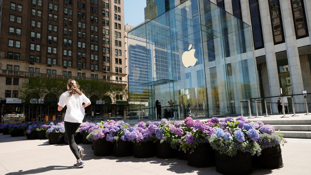 NEW YORK, NEW YORK - MAY 01: A jogger jogs past the Fifth Avenue Blooms Mother's Day installation in front of The Apple store on May 01, 2021 in New York City. (Photo by Michael Loccisano/Getty Images for Fifth Avenue Blooms Mother's Day Installation)