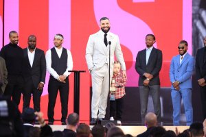2021 BILLBOARD MUSIC AWARDS -- Pictured: (l-r) Drake accepts Artist of the Decade with son Adonis on the plaza stage during the 2021 Billboard Music Awards held at the Microsoft Theater on May 23, 2021 -- (Photo by: Christopher Polk/NBC)