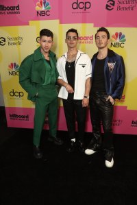 2021 BILLBOARD MUSIC AWARDS -- Pictured: (l-r) Nick Jonas, Joe Jonas, and Kevin Jonas of Jonas Brothers arrive to the 2021 Billboard Music Awards held at the Microsoft Theater on May 23, 2021 in Los Angeles, California. --  (Photo by: Todd Williamson/NBC)