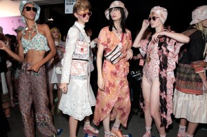 Models backstage in looks from Anna Sui's Spring 2019 ready to wear collection.