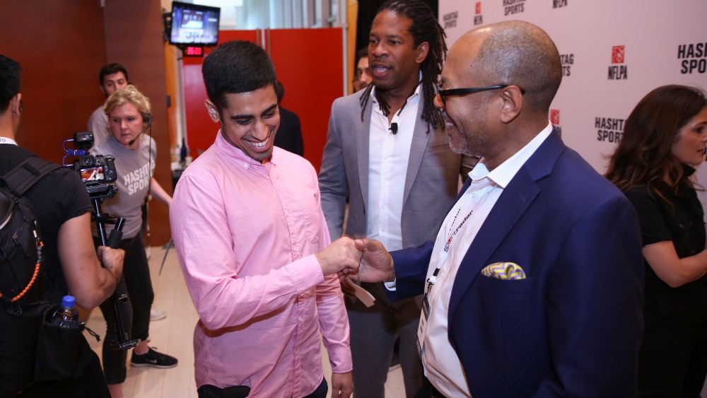 IMAGE DISTRIBUTED FOR HASHTAG SPORTS - Omar Raja, left, creator of House of Highlights on Instagram, greets journalists LZ Granderson and Kevin Merida at the Hashtag Sports 2018 conference on Wednesday, June 27, 2018, in New York. (Kevin Hagen/Hashtag Sports via AP Images)