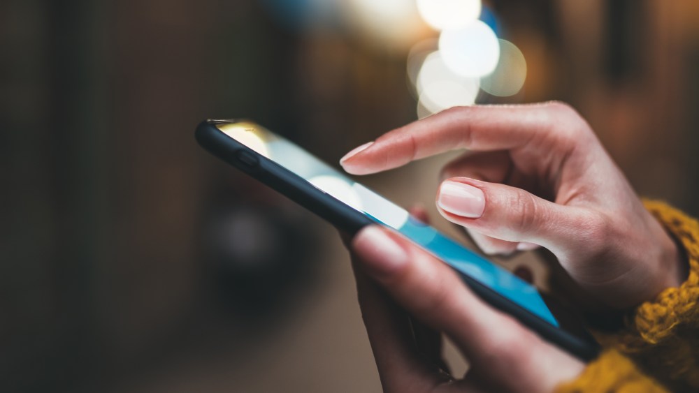 point finger on screen phone closeup, person texting text message, hipster touch blue screen on smartphone light night city, girls using in hands mobile phone close up, online wi-fi