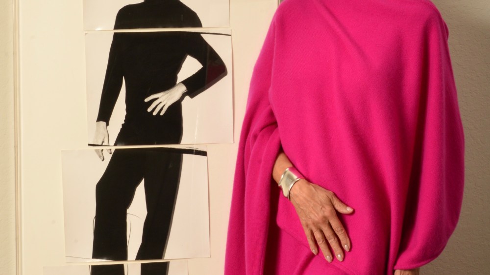 Lesley Frowick beside a photo of her uncle Halston.