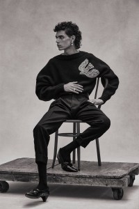 Alexander McQueen’s cashmere and wool sweater and pants. Agmes earring; Comme des Garçons Homme Plus shoes.