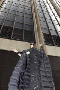 Rick Owens’ nylon coat, stretch denim dress, jersey t-shirt and cotton mask. Moncler glasses; Chanel bracelet.