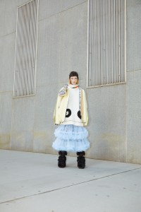 Louis Vuitton’s  nylon parka, cotton pullover and tulle skirt. Chanel boots & earring; Kule balaclava.