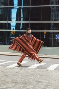 Chloé’s cashmere blanket poncho; Hermès technical canvas pants with reflective bands. Bogner gloves.