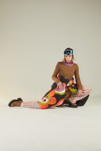 Gabriela Hearst’s cashmere dress over Nina Ricci’s nylon trousers; Vivetta’s embroidered nylon coat; Kule balaclava; Sportmax boots; Louis Vuitton goggles.