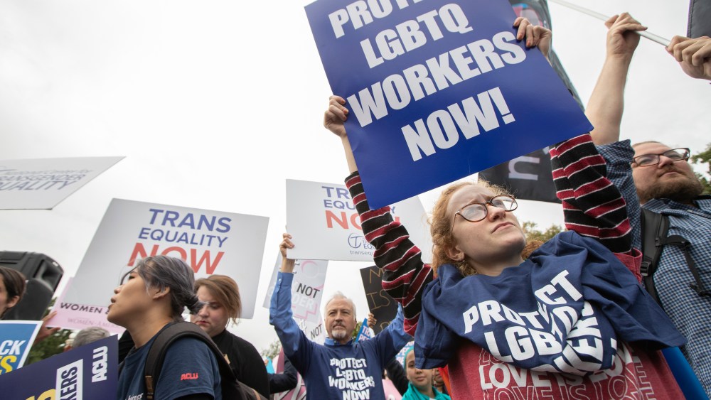 Abigail Olivieri from upstate New York and other LGBT supporters in front of the U.S. Supreme Court, Tuesday, Oct. 8, 2019, in Washington. The Supreme Court is set to hear arguments in its first cases on LGBT rights since the retirement of Justice Anthony Kennedy. Kennedy was a voice for gay rights while his successor, Brett Kavanaugh, is regarded as more conservative. (AP Photo/Manuel Balce Ceneta)
