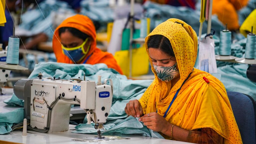 Garment workers work in a sewing section of the MG Niche Stitch Limited in Gazipur. (Photo by Zabed Hasnain Chowdhury / SOPA Images/Sipa USA)(Sipa via AP Images)