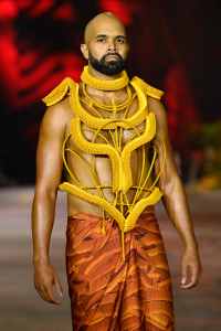 SYDNEY, AUSTRALIA - JUNE 02: A model walks the runway in a design by Grace Lillian Lee during the First Nations Fashion + Design show during Afterpay Australian Fashion Week 2021 Resort '22 Collections at Carriageworks on June 02, 2021 in Sydney, Australia. (Photo by Stefan Gosatti/Getty Images)