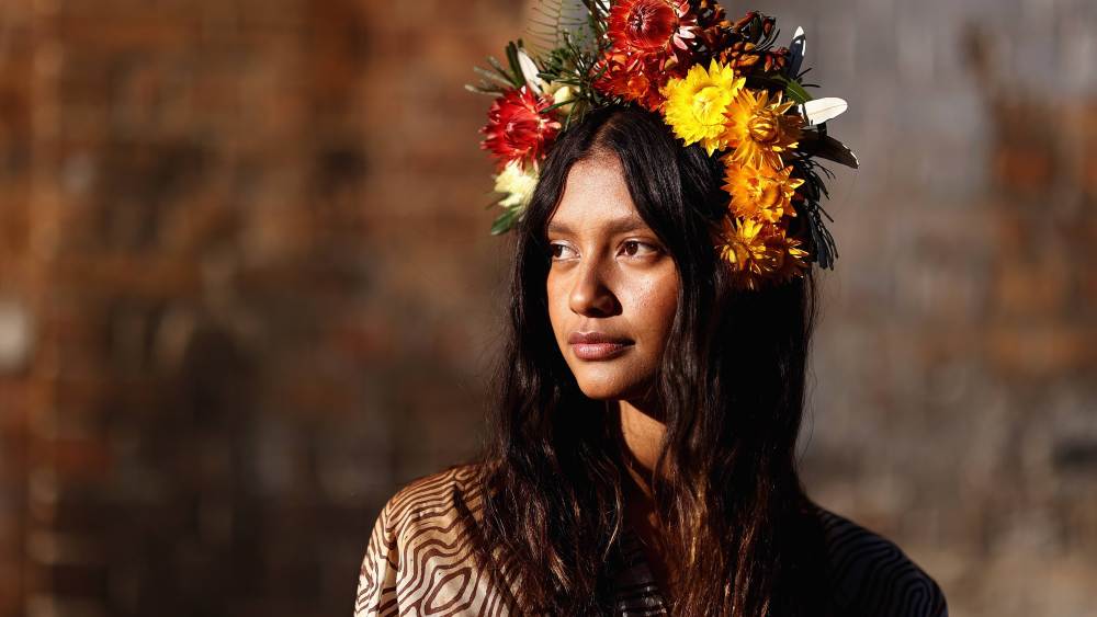 SYDNEY, AUSTRALIA - MAY 31: Indigenous model Lisa Fatnowna poses at the Welcome To Country for Afterpay Australian Fashion Week 2021 at the Blacksmith's Workshop, Carriageworks on May 31, 2021 in Sydney, Australia. (Photo by Cameron Spencer/Getty Images)