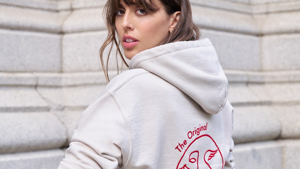 Violette in a Bisous hoodie.