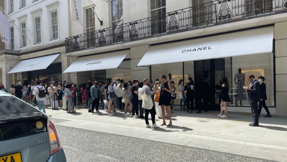 People queue up outside Chanel stores across London for new collection drop