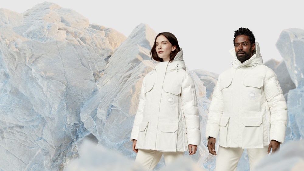 man and woman in white parka