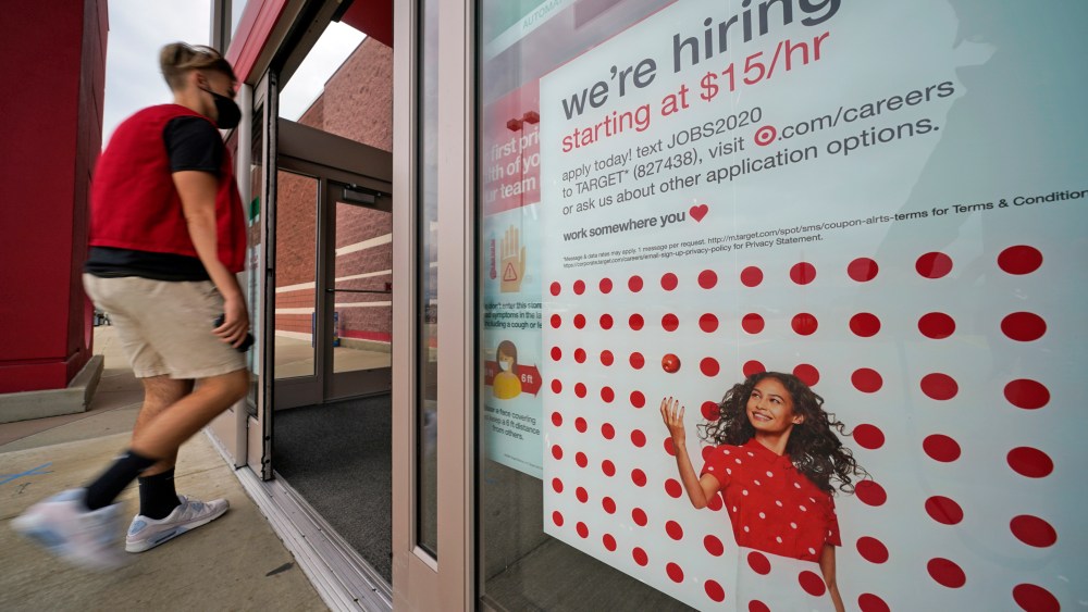 This is a help wanted sign on the door of a Target store in Uniontown, Pa., on Wednesday, Sept. 2, 2020. (AP Photo/Gene J. Puskar)