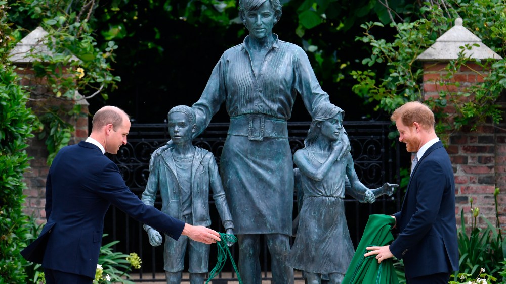 Diana's 60th birthday. The Duke of Cambridge (left) and Duke of Sussex unveiling a statue they commissioned of their mother Diana, Princess of Wales, in the Sunken Garden at Kensington Palace, London, on what would have been her 60th birthday. Picture date: Thursday July 1, 2021. See PA story ROYAL Diana. Photo credit should read: Dominic Lipinski/PA Wire URN:60681704 (Press Association via AP Images)