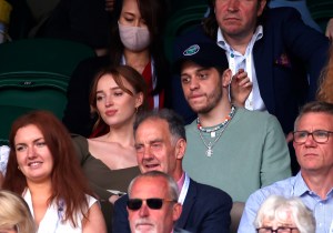 Wimbledon 2021 - Day Six - The All England Lawn Tennis and Croquet Club. Phoebe Dynevor and Pete Davidson watch a match at centre court on day six of Wimbledon at The All England Lawn Tennis and Croquet Club, Wimbledon. Picture date: Saturday July 3, 2021. See PA story TENNIS Wimbledon. Photo credit should read: Steven Paston/PA Wire. RESTRICTIONS: Editorial use only. No commercial use without prior written consent of the AELTC. Still image use only - no moving images to emulate broadcast. No superimposing or removal of sponsor/ad logos. URN:60721587 (Press Association via AP Images)