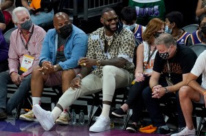 Los Angeles Lakers basketball player LeBron James smiles during the second half of Game 5 of basketball's NBA Finals between the Phoenix Suns and the Milwaukee Bucks, Saturday, July 17, 2021, in Phoenix. (AP Photo/Ross D. Franklin)