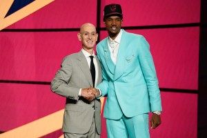 Evan Mobley, right, poses for a photo with NBA Commissioner Adam Silver after being selected third overall by the Cleveland Cavaliers during the NBA basketball draft, Thursday, July 29, 2021, in New York. (AP Photo/Corey Sipkin)