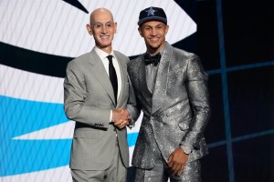 Jalen Suggs, right, poses for a photo with NBA Commissioner Adam Silver after being selected fifth overall by the Orlando Magic during the first round of the NBA basketball draft, Thursday, July 29, 2021, in New York. (AP Photo/Corey Sipkin)