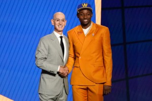 Jonathan Kuminga, right, poses for a photo with NBA Commissioner Adam Silver after being selected seventh overall by the Golden State Warriors during the NBA basketball draft, Thursday, July 29, 2021, in New York. (AP Photo/Corey Sipkin)