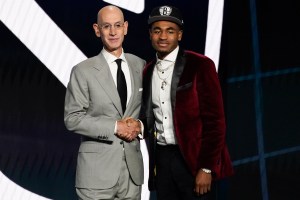 Cameron Thomas, right, poses for a photo with NBA Commissioner Adam Silver after being selected 27th overall by the Brooklyn Nets during the NBA basketball draft, Thursday, July 29, 2021, in New York. (AP Photo/Corey Sipkin)