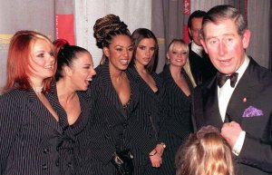 Britain's Prince Charles meets the Spice Girls in London, Monday Dec.15, 1997 on the occasion of the premiere of their movie Spice World. From left, Ginger Spice, real name Geraldine Halliwell, 24; Sporty Spice, Melanie Chisholm, 22, Scary Spice, Melanie Brown, 21; Posh Spice, Victoria Adams, 22; Baby Spice, Emma Bunton, 20. Actor Richard E. Grant seen in background. (AP Photo/John Stillwell)