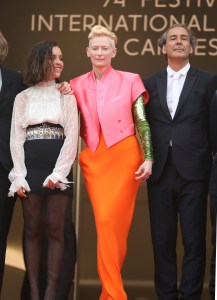 Lyna Khoudri, from left, Tilda Swinton, and Alexandre Desplat pose for photographers upon arrival at the premiere of the film 'The French Dispatch' at the 74th international film festival, Cannes, southern France, Monday, July 12, 2021. (Photo by Vianney Le Caer/Invision/AP)