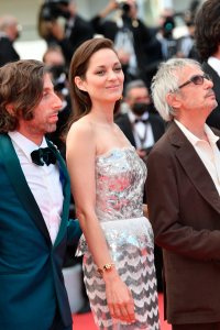 Simon Helberg, Marion Cotillard and director Leos Carax attending the 'Annette' screening and opening ceremony during the 74th annual Cannes Film Festival on July 06, 2021 in Cannes, France.  Photo by David Niviere/Abaca/Sipa USA(Sipa via AP Images)