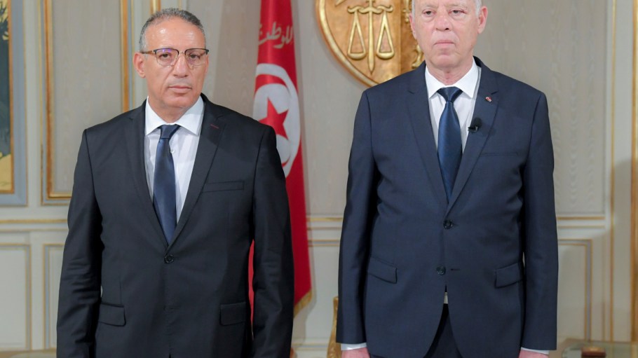 New acting Tunisian Interior Minister Ridha Gharsallaoui, left, and Tunisian President Kais Saied poses after a sworn in ceremony at the Presidential Palace in Carthage, outside Tunis, Tunisia, Thursday, July 29, 2021. Tunisian President Kais Saied on Thursday appointed Ridha Gharsallaoui, a former national security adviser to the presidency, to run the Interior Ministry.