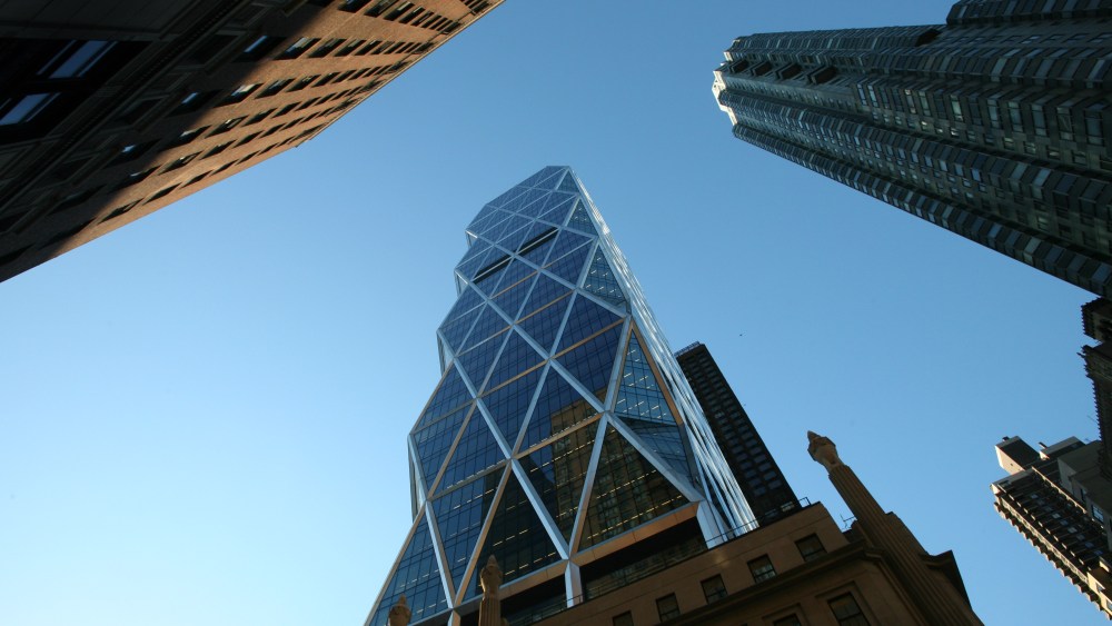 The Hearst Tower, center, is shown on Thursday, Jan. 3, 2008 in New York. The tower, designed by architect Norman Foster and constructed by Turner Construction, is the world headquarters of the Hearst Corporation. (AP Photo/Mark Lennihan)