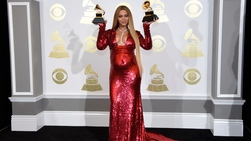 Beyonce poses in the press room with the awards for best music video for "Formation" and best urban contemporary album for "Lemonade" at the 59th annual Grammy Awards at the Staples Center on Sunday, Feb. 12, 2017, in Los Angeles. (Photo by Chris Pizzello/Invision/AP)