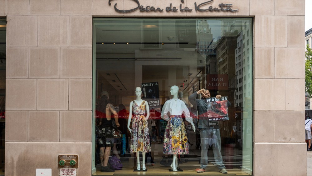 Animal rights activists protest inside designer store Oscar de la Renta in New York City on July 10, 2021. The activists call on the luxury label to join Canada Goose and Saks Fifth Avenue, which recently announced that they would phase out the sale of fur products in their stores. (Photo by Gabriele Holtermann/Sipa USA)(Sipa via AP Images)