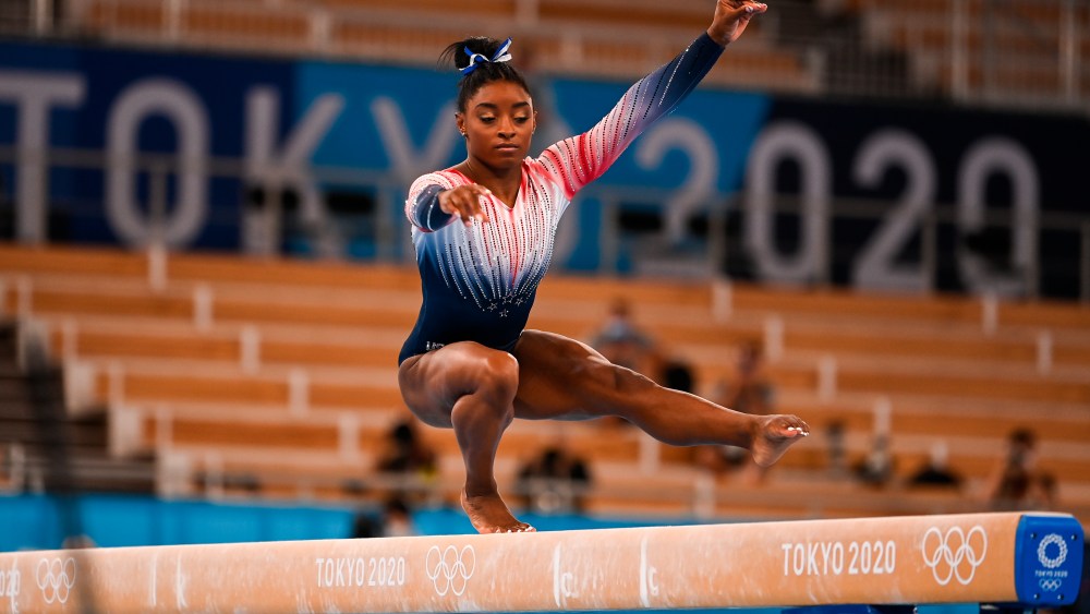 Simone Biles, of the United States, performs in the women's balance beam final of the artistic gymnastics event at the Tokyo 2020 Olympic Games at Ariake Gymnastics Centre in Tokyo, Japan. Grigory Sysoev / Sputnik via AP