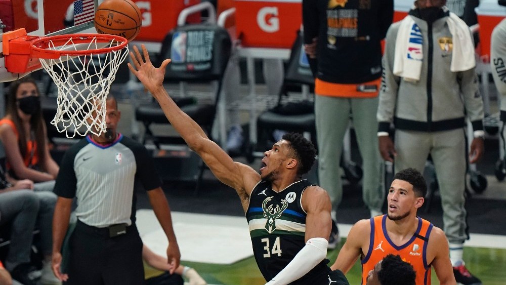 NBA Finals rivals Giannis Antetokounmpo (left) and Devin Booker (right), both two of the top scorers in the NBA Playoffs, both wear Nike shoes.