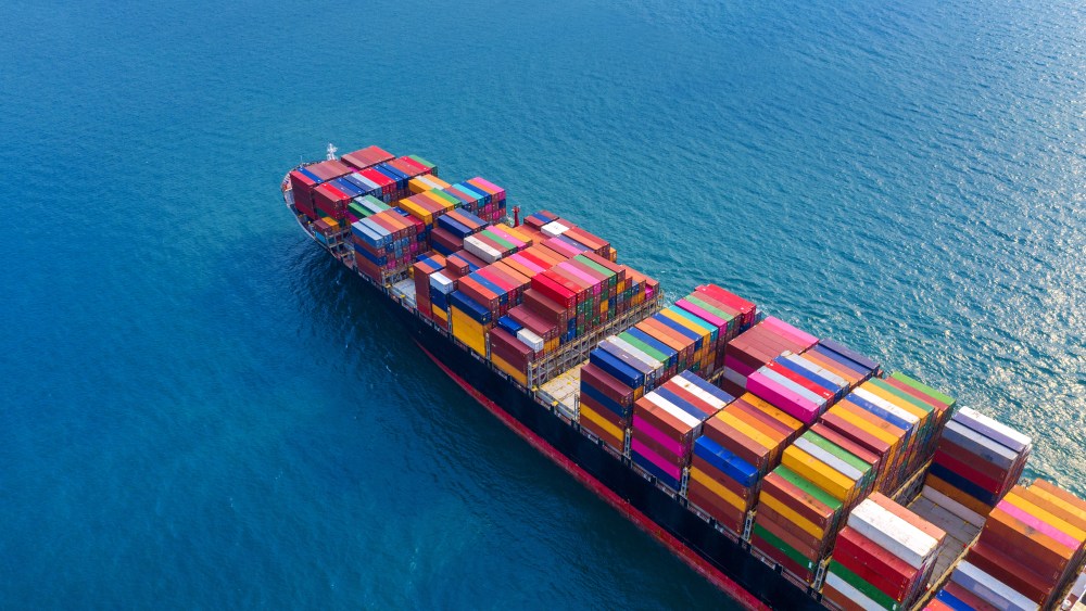 Aerial view of container cargo ship in sea.