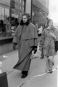 A man strolls down New York City's Fifth Avenue in a double-mantle cloak on January 9, 1976.