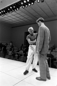 Designer Giorgio Armani directs models during rehearsal in preparation for Armani's promotional dinner and fashion show in Los Angeles.