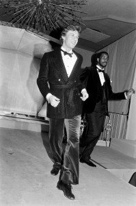 Models pose in formal wear from Christian Dior's fall 1980 menswear collection.