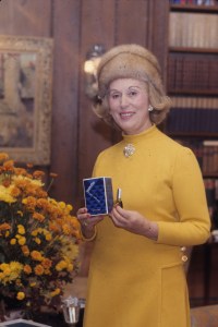 Estee Lauder poses with the packaging and bottle for her second fragrance Estee Super Cologne spray in her New York home in 1968.