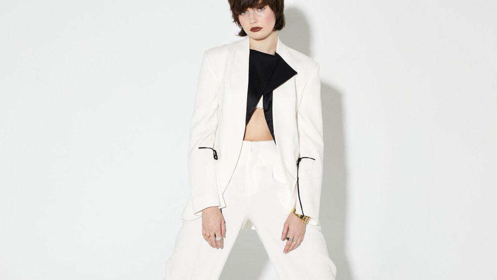 Ashlyn’s wool gabardine suit and Aya Muse’s viscose and nylon bralette. Eytys boots; IceLink watch; Sophie Bille Brahe pearl necklace; Pattaraphan necklace; Other People’s Property necklace and rings; Mam rings.