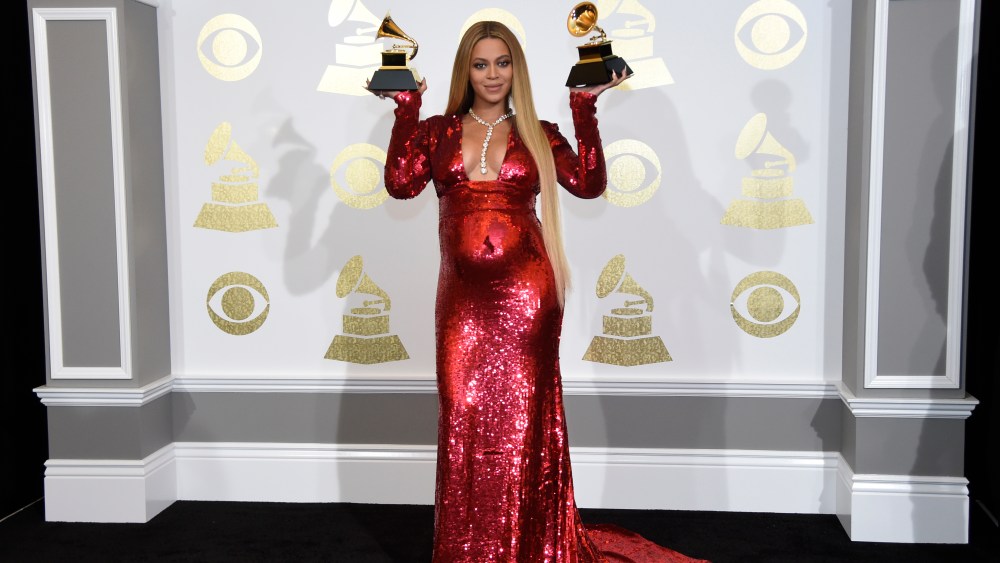 Beyonce poses in the press room with the awards for best music video for "Formation" and best urban contemporary album for "Lemonade" at the 59th annual Grammy Awards at the Staples Center on Sunday, Feb. 12, 2017, in Los Angeles. (Photo by Chris Pizzello/Invision/AP)
