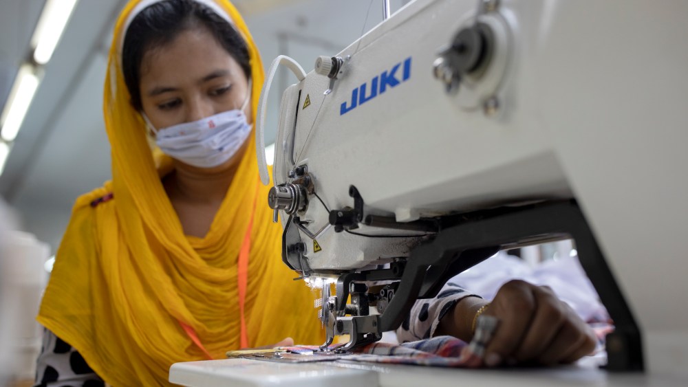 25 July 2020, Bangladesh, Dhaka: A woman works in a textile factory. Bangladesh is the second largest producer of textiles after China. The working conditions and the environmental protection of the local production gives cause for criticism again and again. In Bangladesh, thousands of factory employees - mainly women - have lost their jobs in the corona crisis, after international fashion chains cancelled many orders due to corona. Photo by: K M Asad/picture-alliance/dpa/AP Images