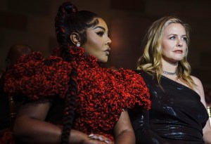 Rapper Lil' Kim, left, and actress Alicia Silverstone attend the Christian Siriano fashion show, during Fashion Week, Tuesday, Sept. 7, 2021, in New York. (AP Photo/Bebeto Matthews)