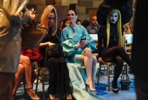 Canadian model Coco Rocha, second from right, takes her seat in the front row before the Christian Siriano fashion show during Fashion Week, Tuesday, Sept. 7, 2021, in New York. (AP Photo/Bebeto Matthews)