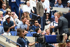 Alec Baldwin speaks with Brad Pitt, Bradley Cooper and Rami Malek during the Men's Singles championship match at the 2021 US Open, Sunday, Sep. 12, 2021 in Flushing, NY. (Garrett Ellwood/USTA via AP)