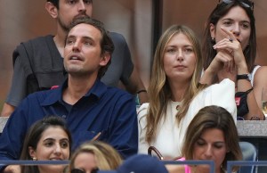 Alexander Gilkes and Maria Sharapova watch the Men's Singles championship match at the 2021 US Open, Sunday, Sep. 12, 2021 in Flushing, NY. (Darren Carroll/USTA via AP)