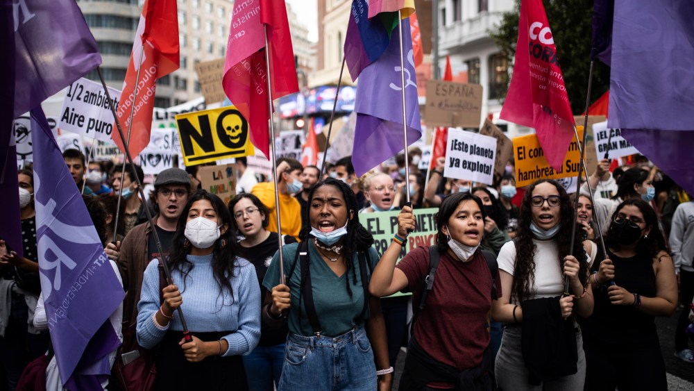 Several people with posters and banners, participate in a demonstration for the 'Global strike for the climate', in the Plaza de Callao, on September 24, 2021, in Madrid (Spain). The protest movement driven by Fridays for Future-Youth for Climate calls for this Friday a new Global Day of Action for Climate. This time, the day is dedicated to demand justice in the face of the climate emergency and show support to the so-called Climate Trial, which already has more than 48,000 signatures; the complaint filed before the Supreme Court by several organizations against the Government for its lack of commitment and ambition on the issue. According to the promoters, rallies have been called in 16 different locations to demand "ambitious", "immediate" and "concrete" measures for the climate crisis. SEPTEMBER 24;2021;MADRID;CLIMATE EMERGENCY;CLIMATE CHANGE;CLIMATE;GLOBAL ACTION;CLIMATE CRISIS Alejandro Martínez Vélez / Europa Press 09/24/2021 (Europa Press via AP)